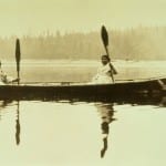 Native Americans in canoe