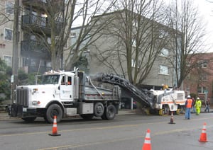 crews grind off old asphalt