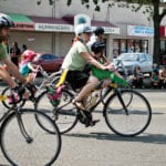 Image of bicyclists riding through Rainier Valley