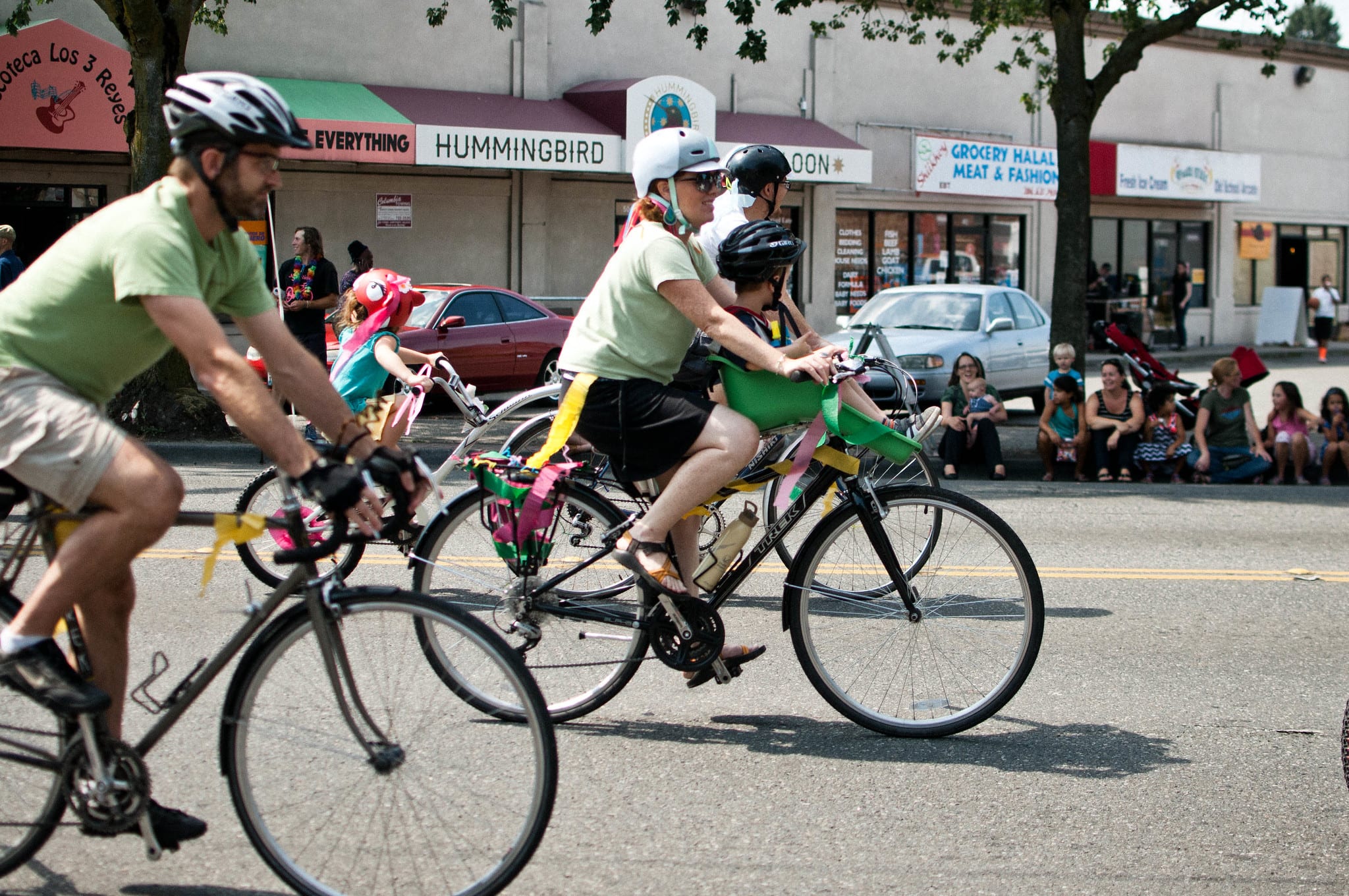 Image of bicyclists riding through Rainier Valley