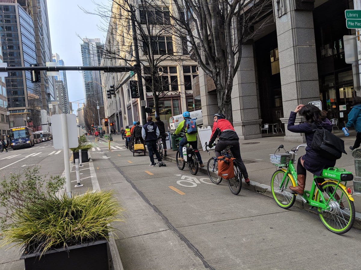 Bike commuters queued up at stoplight on 2nd Avenue.