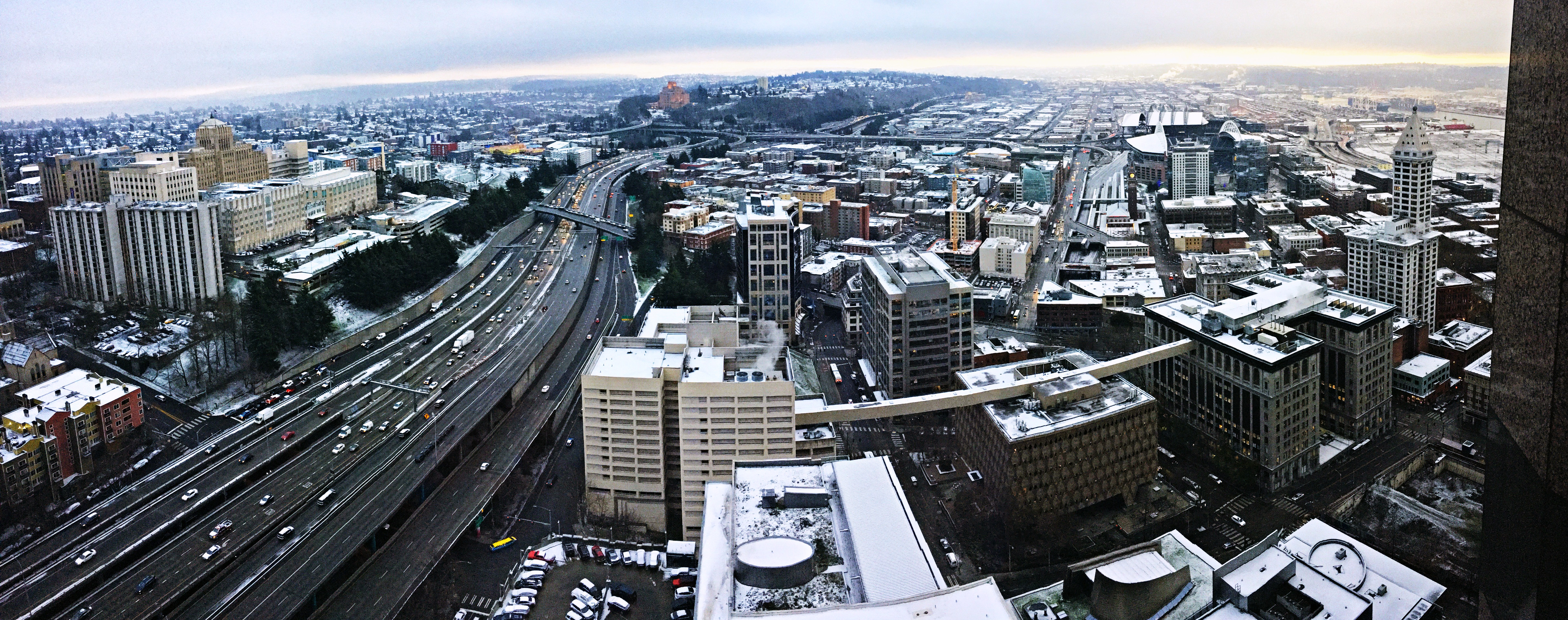 A snow topped city looking south out of the Seattle Municipal Tower.