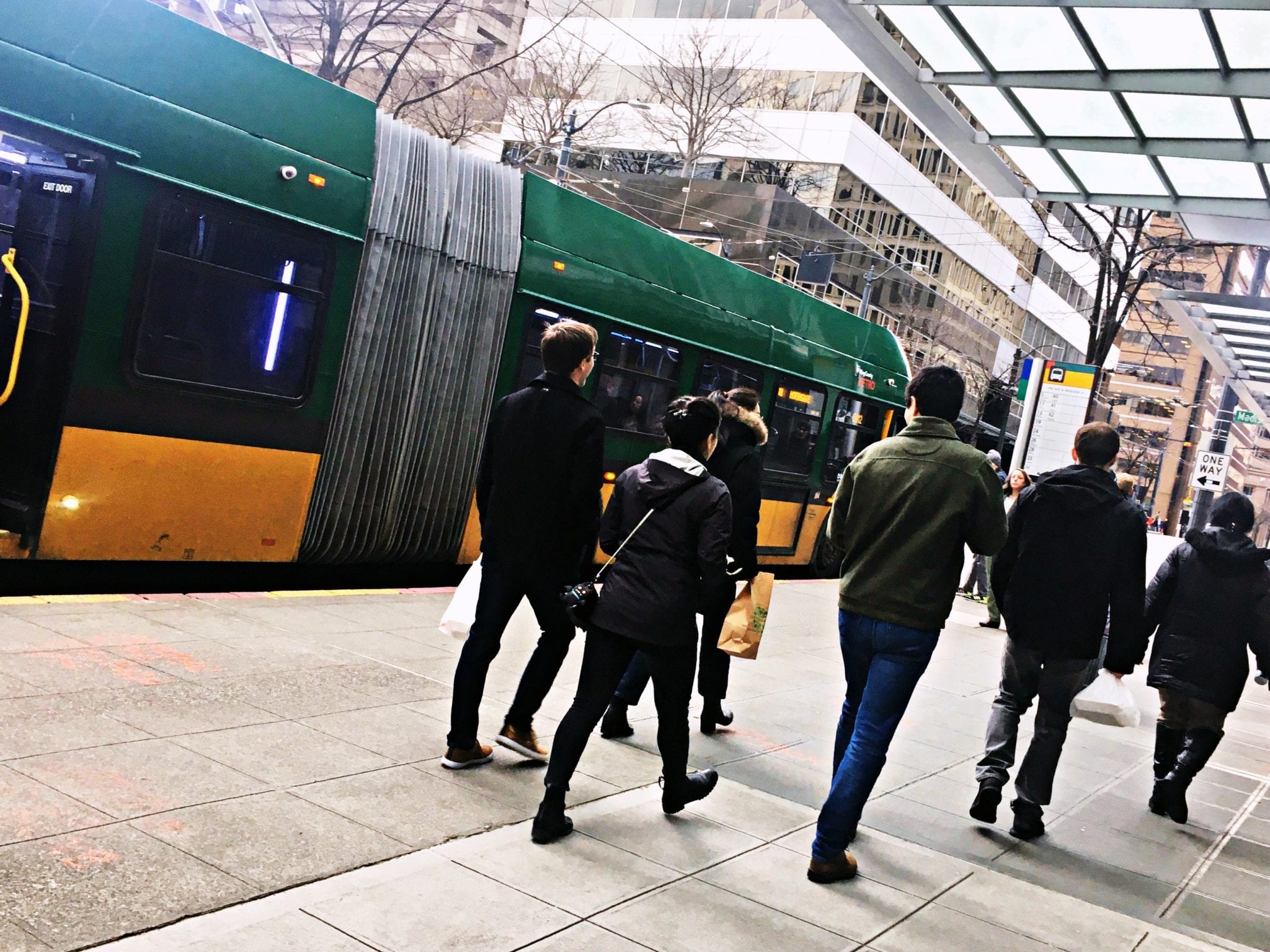 Commuters near a downtown Seattle bus stop.