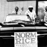 Car with a sign that says "Norm Rice City Council"