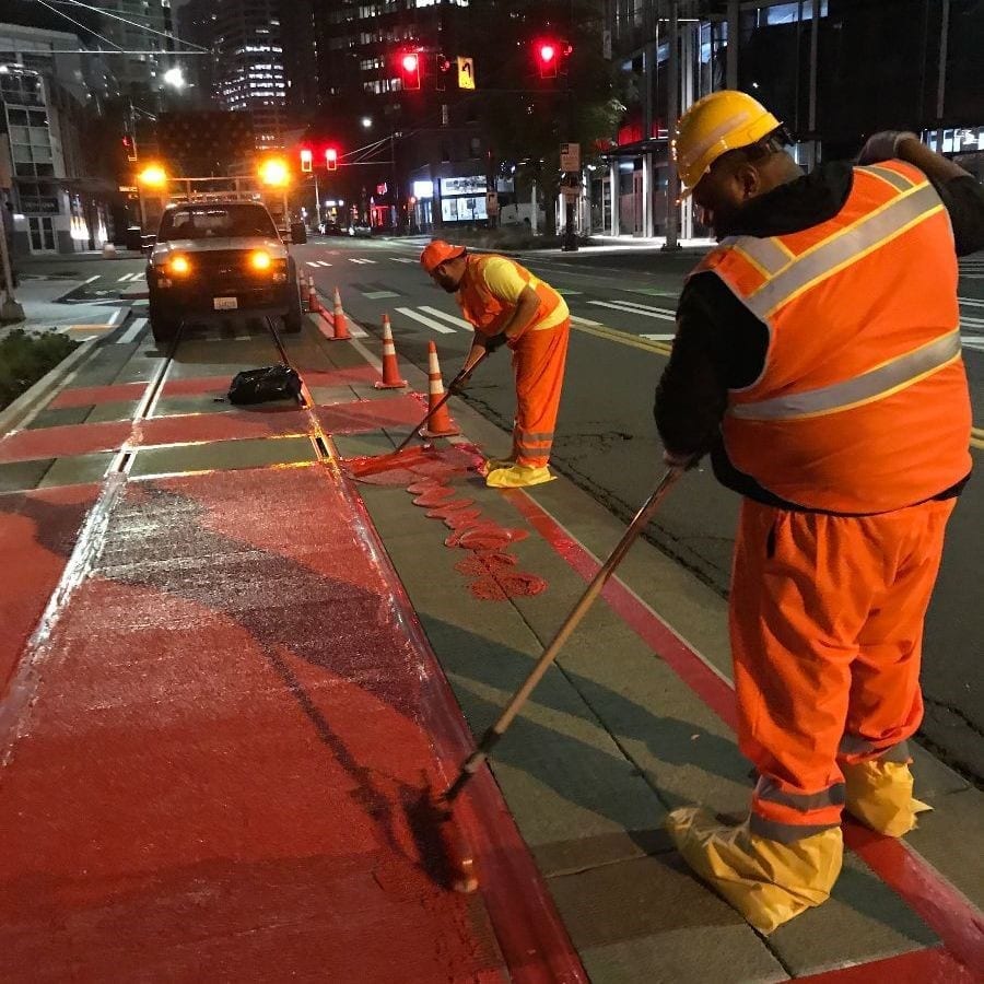 SDOT Crews painting a bus only lane. 