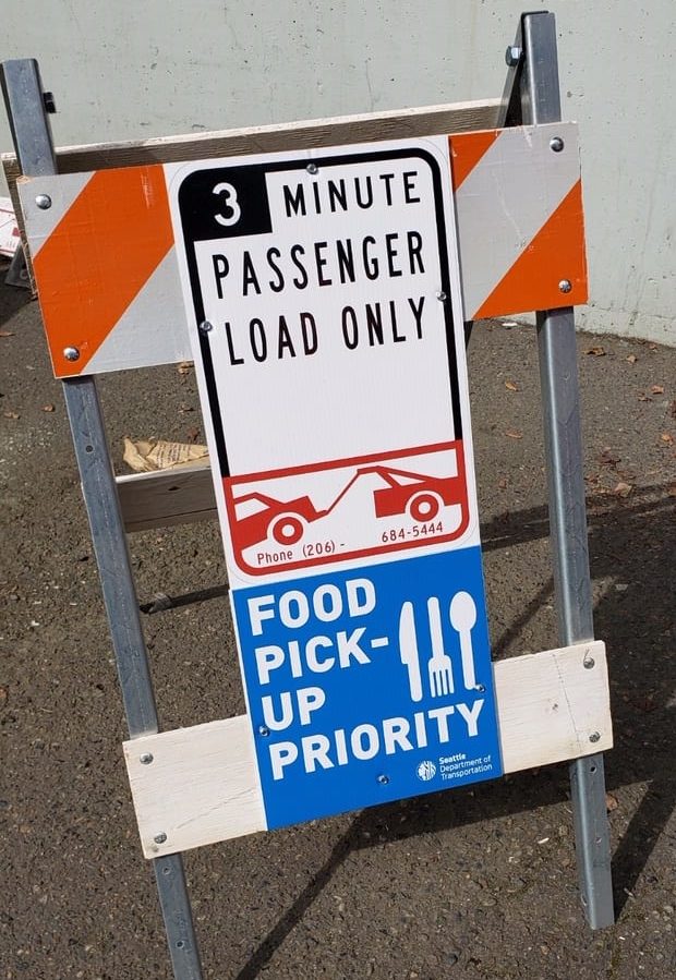 3 minute passenger load only zone, with newly added food pick-up priority signs. 