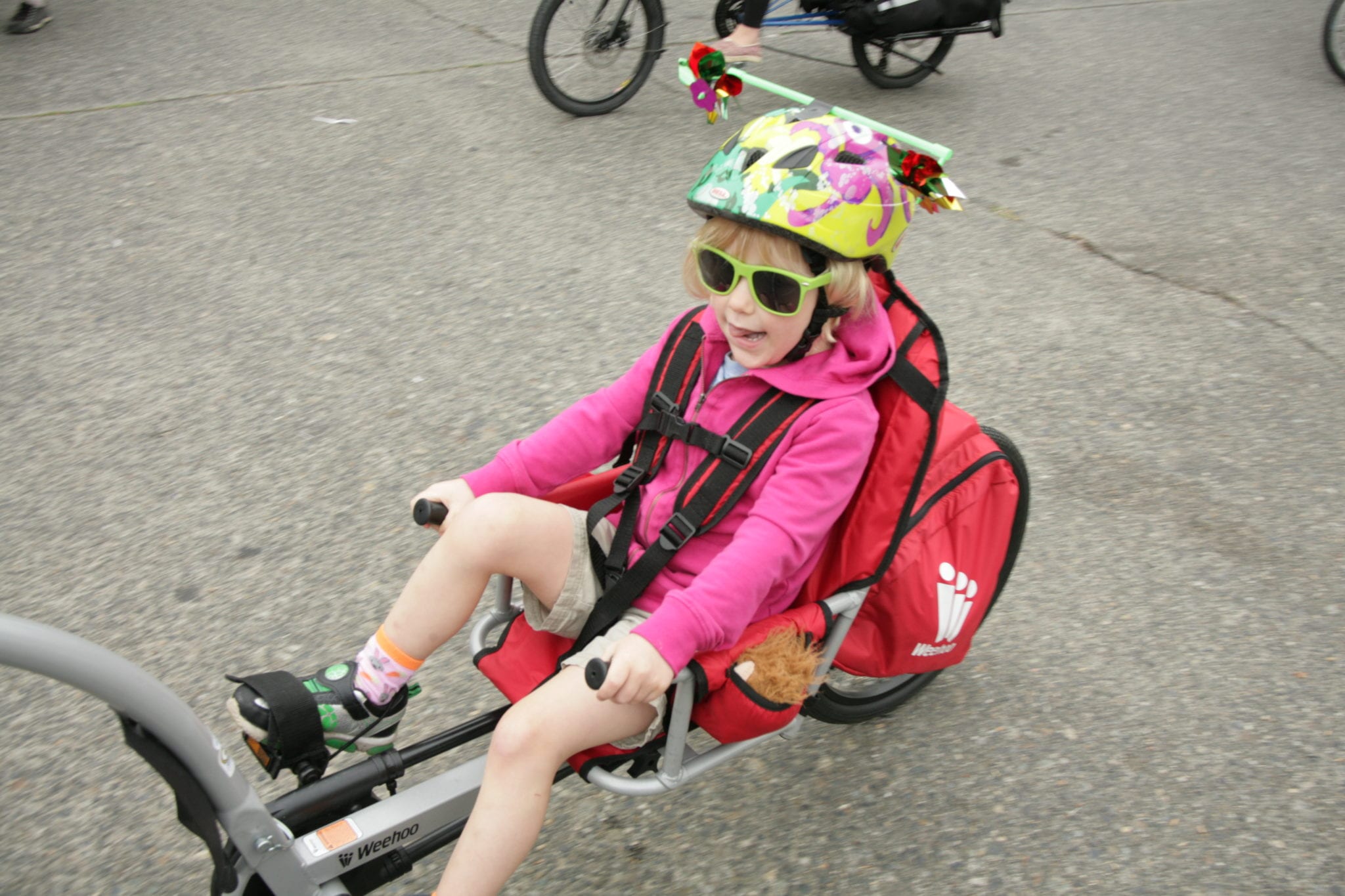 A kid on a recumbent bike.