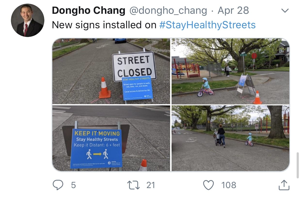 Screen capture of a tweet by Dongho about Stay Healthy Streets featuring four images and a caption that reads "New signs installed on #StayHealthyStreets"