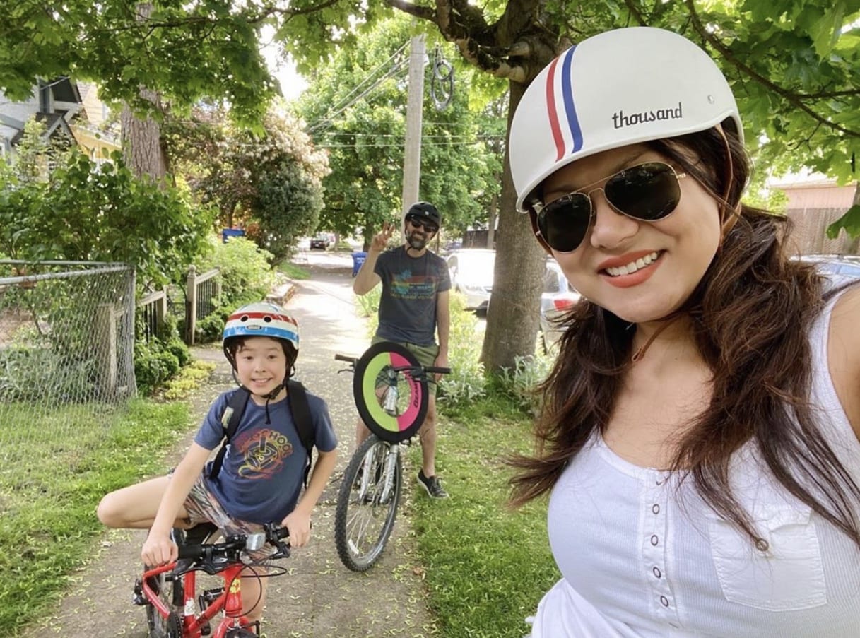 Jeanné and her family riding bikes on the Central District Stay Healthy Street.