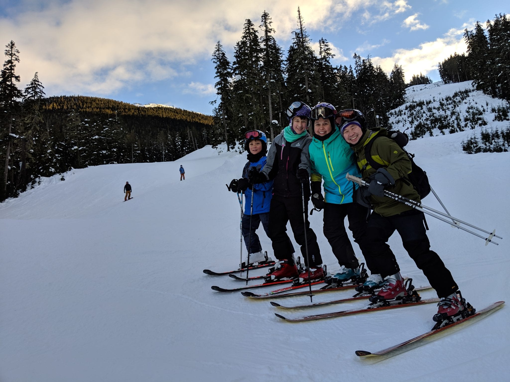 Dongho and his family enjoying a ski trip.