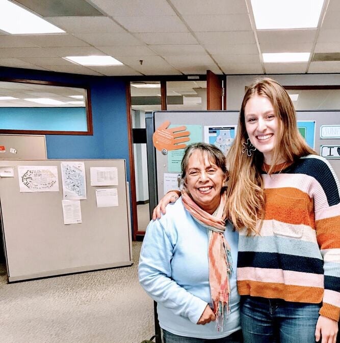 Niki and Carby, our wonderful communications office manager, back when we worked in an office together and were able to hug our friends. 