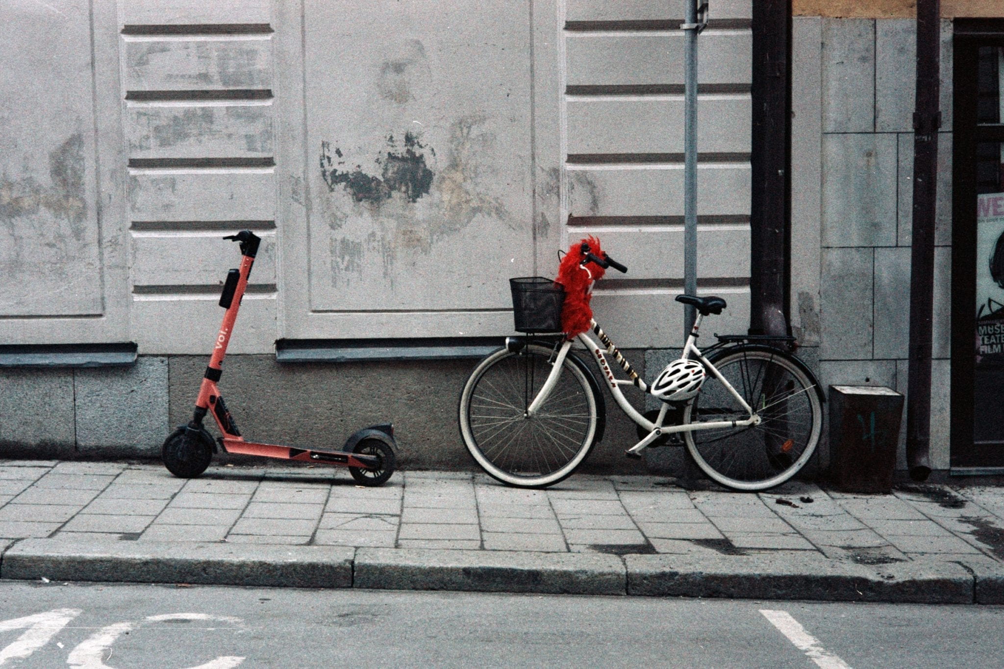 A parked scooter and bicycle. Photo by Gemma Evans on Unsplash