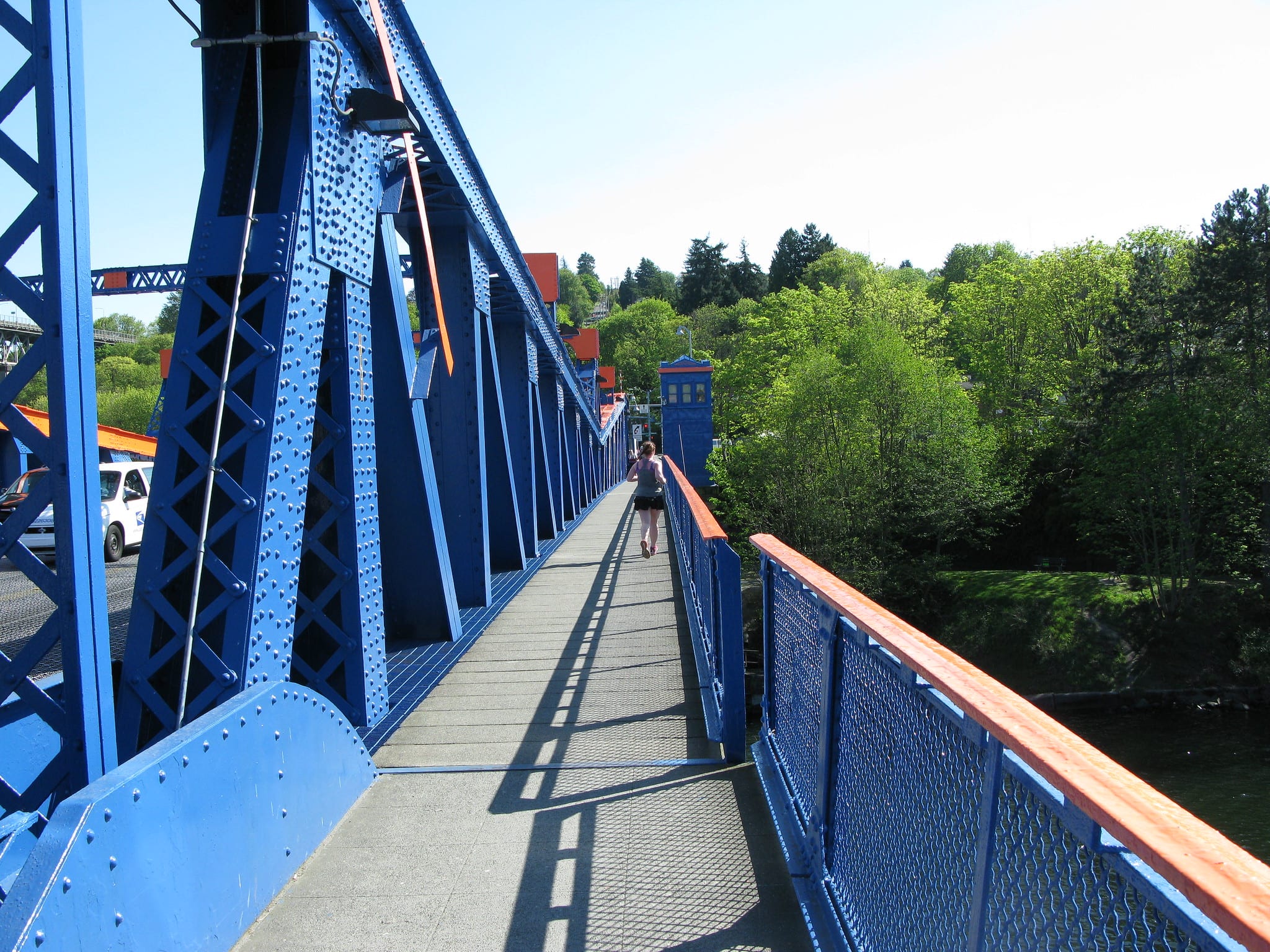 Walking path across the Fremont Bridge. One person is seen running across the bridge.