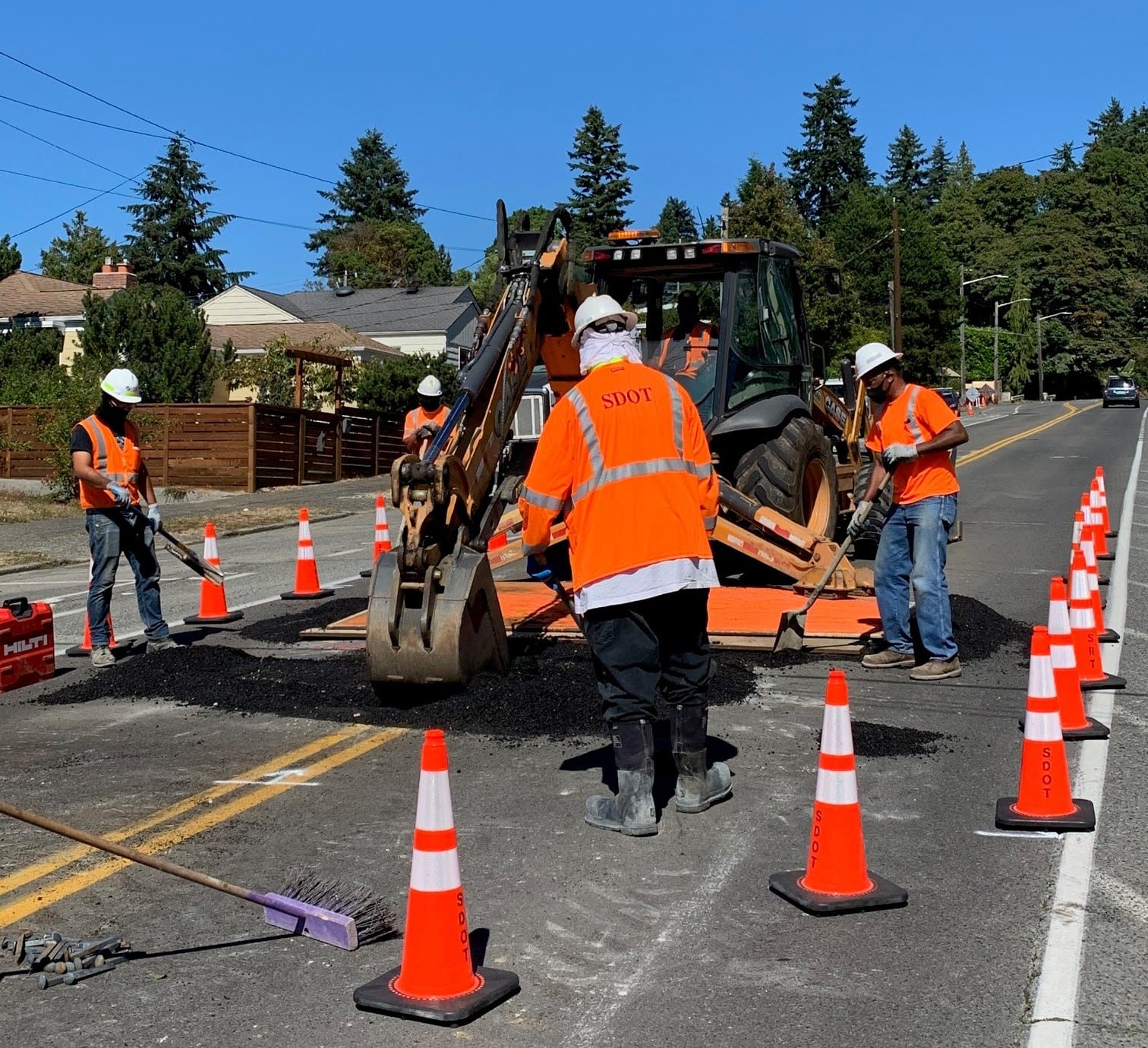 Asphalt and concrete crews pitched in to help out when a sinkhole opened up on Admiral Way SW late last month | Photo by Ken Ewalt