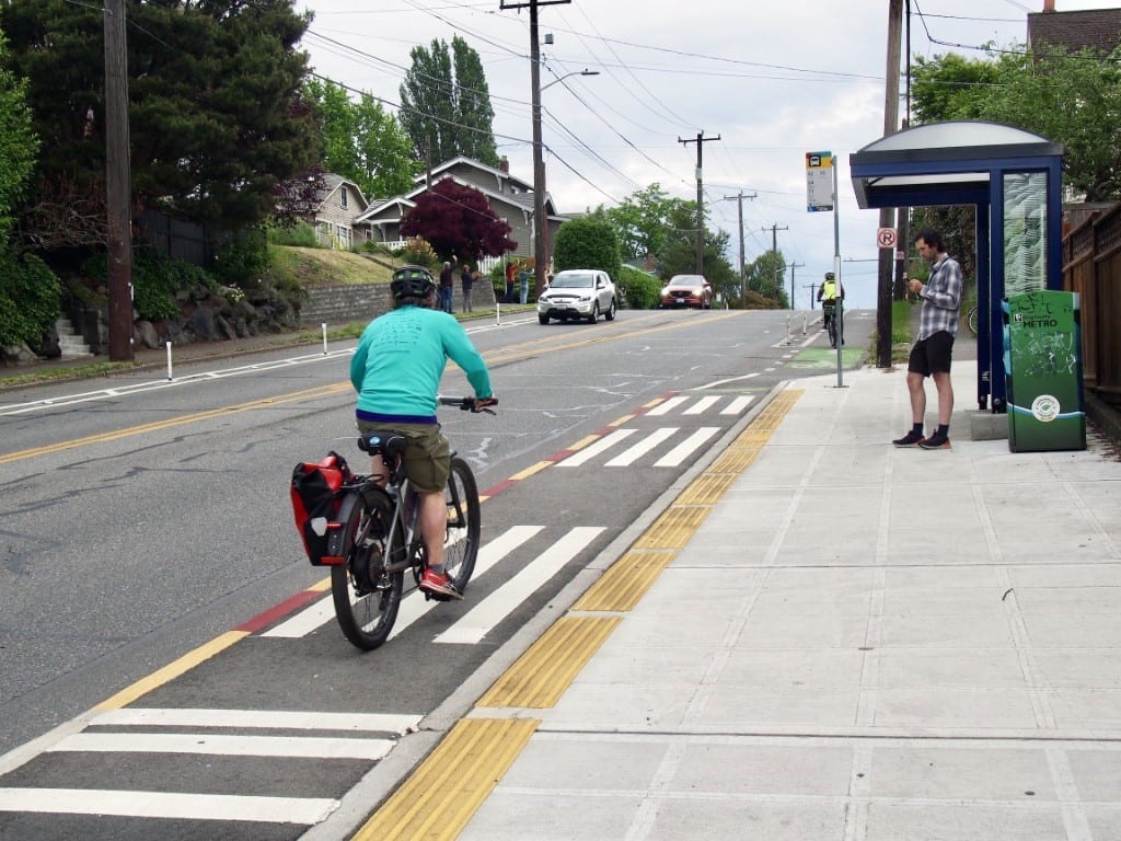 A person rides down a newly painted bike lane.