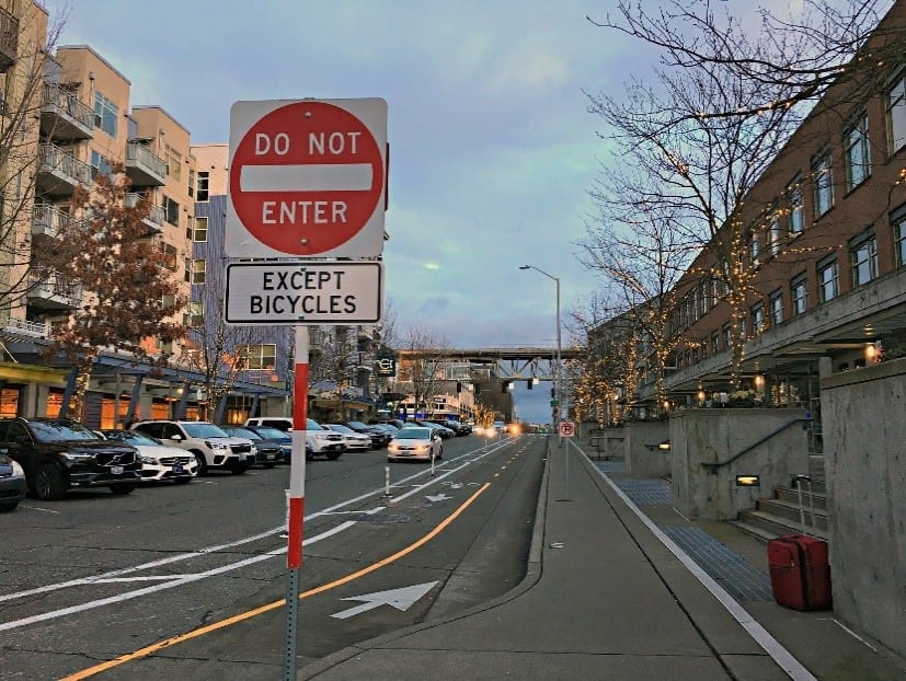 A bike lane in Seattle is shown with a "Do not enter except bicycles" sign.