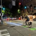 Using the new 4th Ave protected bike lane on a recent fall evening. Photo Credit: Dongho Chang.