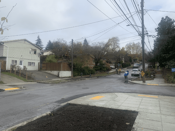 Sidewalks and curb ramps shown in a neighborhood - S Kenyon St near the intersections of 52nd Ave S and Wolcott Ave S.