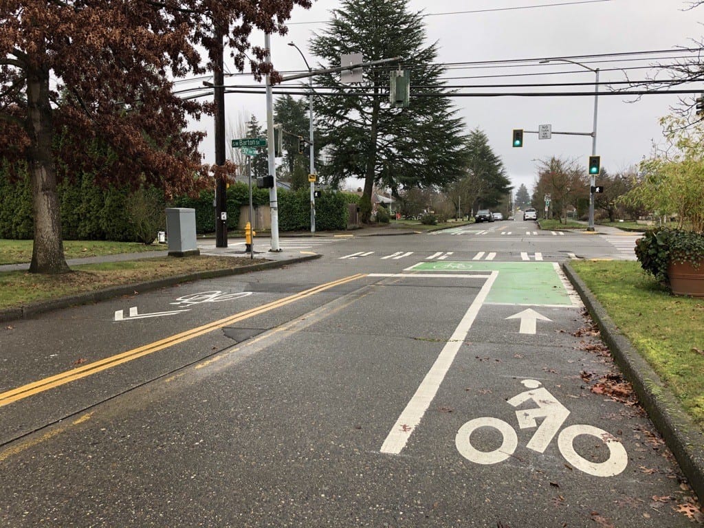 Empty neighborhood two-way street, with bike lane on the right-hand side.