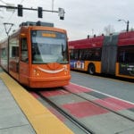 Seattle Streetcar and a RapidRide bus side-by-side.