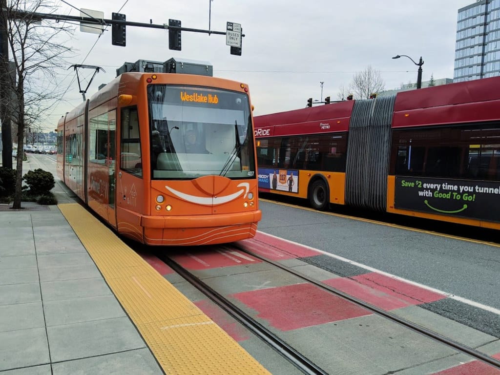Seattle Streetcar and a RapidRide bus side-by-side.