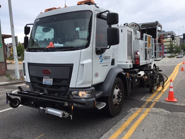 SDOT truck re-striping the road