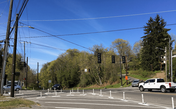 Photo showing the traffic signal installed in March 2020. As part of a Levy to Move Seattle project, the intersection will be upgraded with a more durable signal, new curb ramps, curb bulbs, and crosswalks after the high bridge reopens in mid-2022.