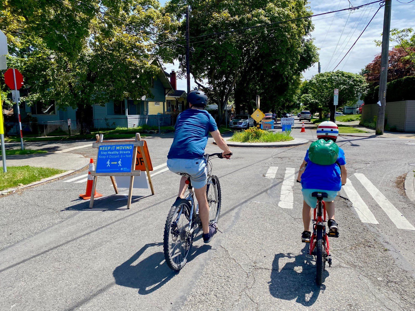 People biking on the Central District Stay Healthy Street