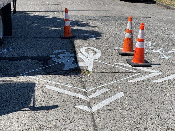 Cones around cracked pavement