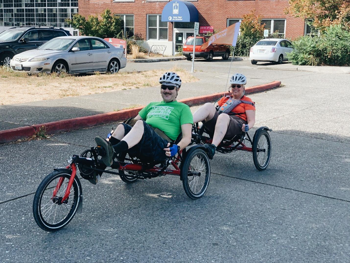 Thyce and Amy head out on their tandem recumbent tricycle ride at Magnuson Park.