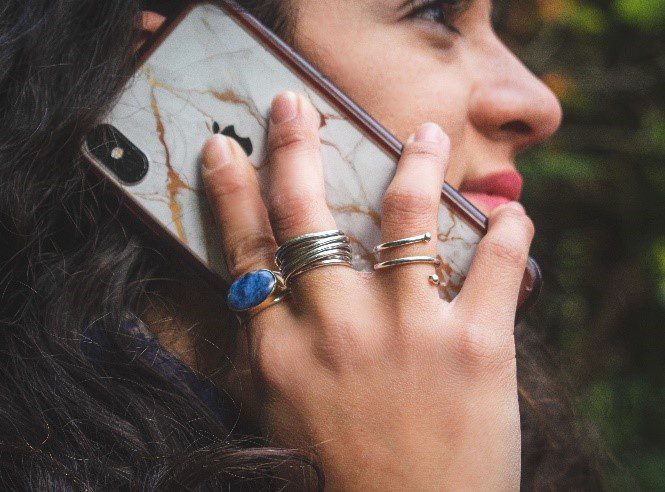 Person talking on the phone. Photo by Patricia Zavala on Unsplash