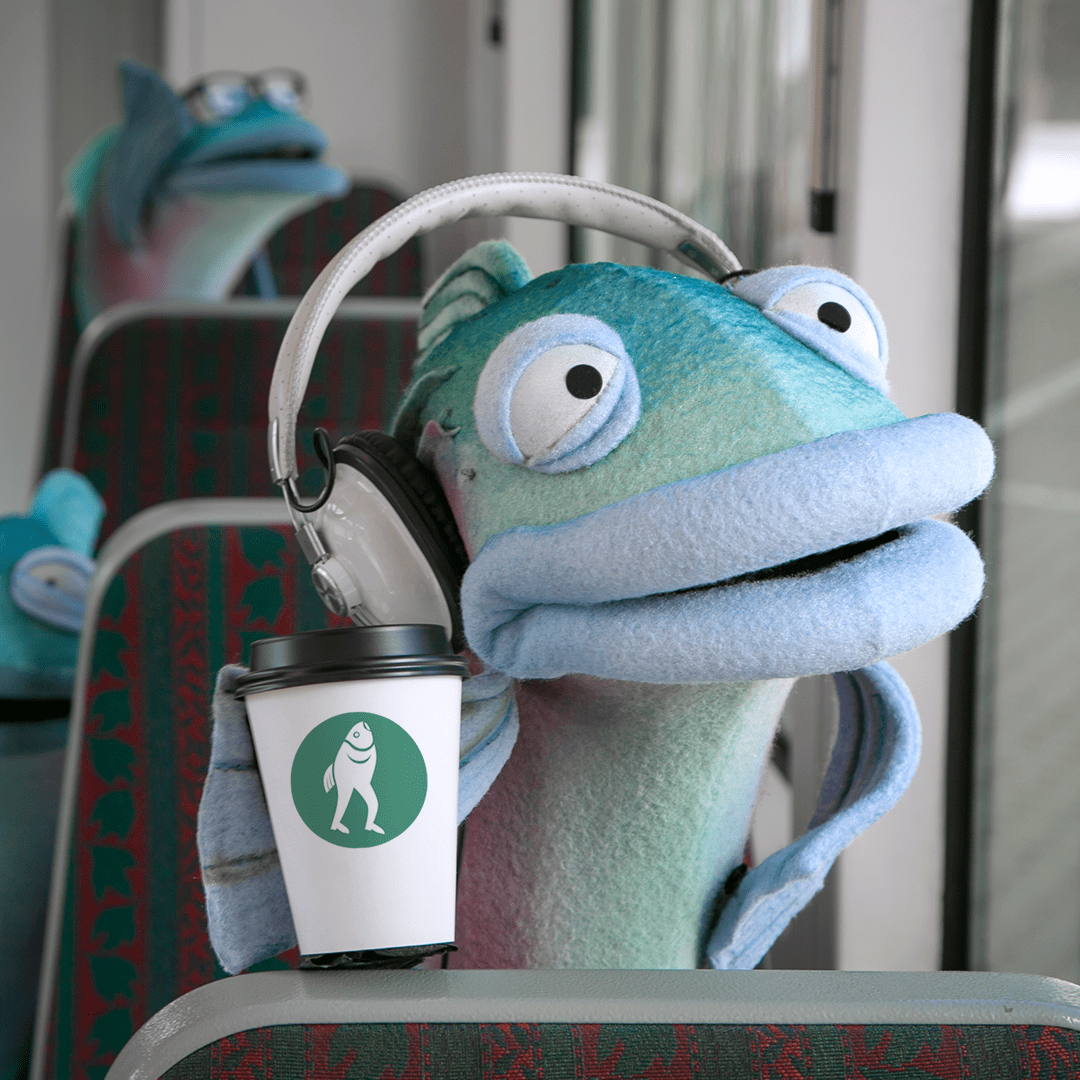 Sal the Salmon rides the bus while listening to a song on her favorite pair of headphones.