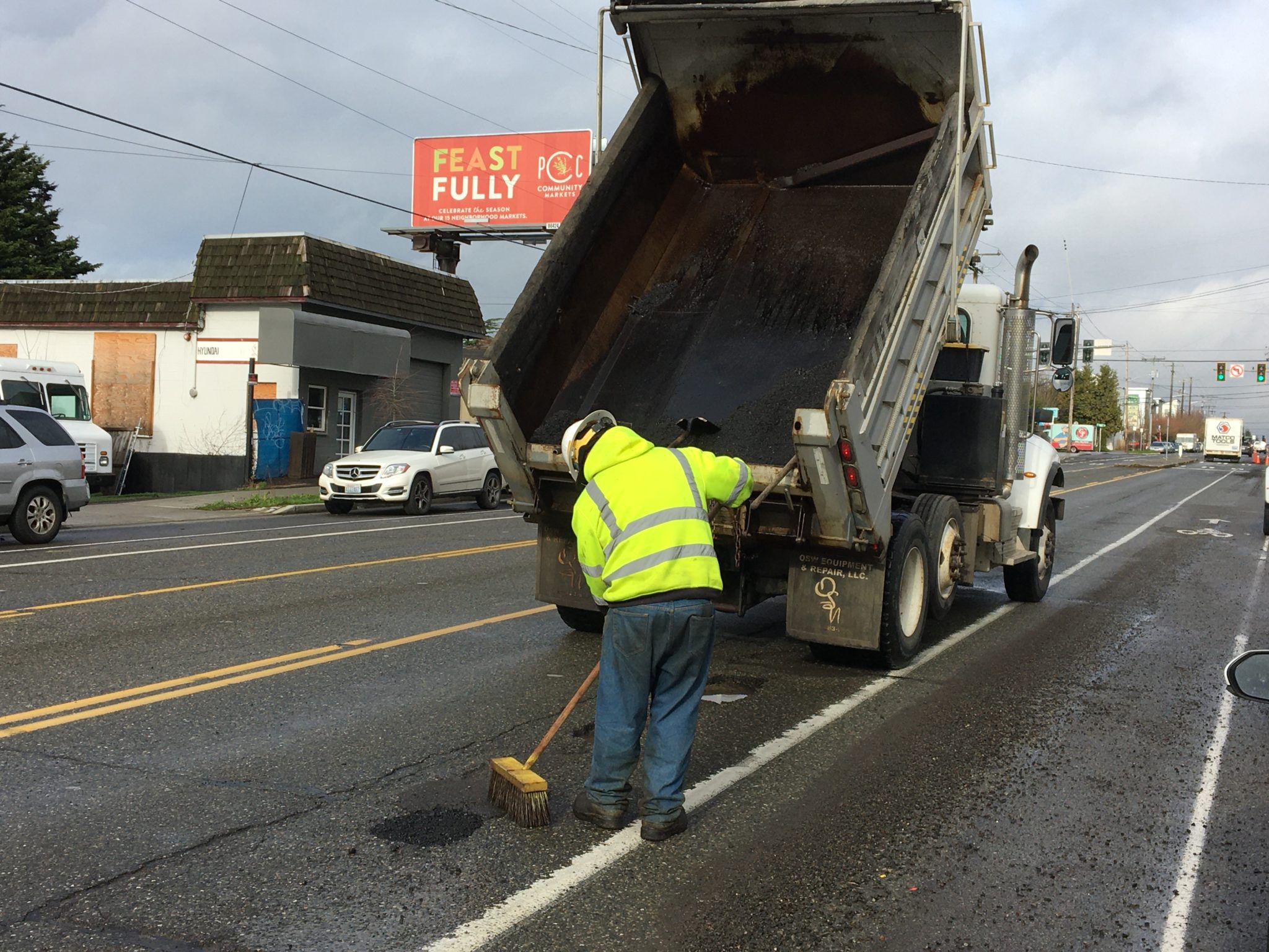 SDOT Crews filling several potholes on Greenwood Ave N near N 100th St on January 13, 2022.