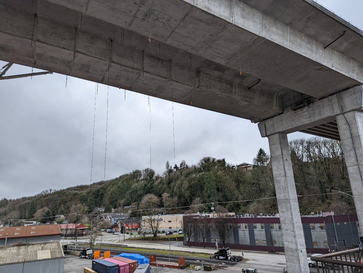 Rigging cables hang from the West Seattle Bridge. The work platforms are attached to these steel cables that will support the weight of the platforms as crews complete epoxy injections and carbon fiber wrapping on the exterior of the bridge.