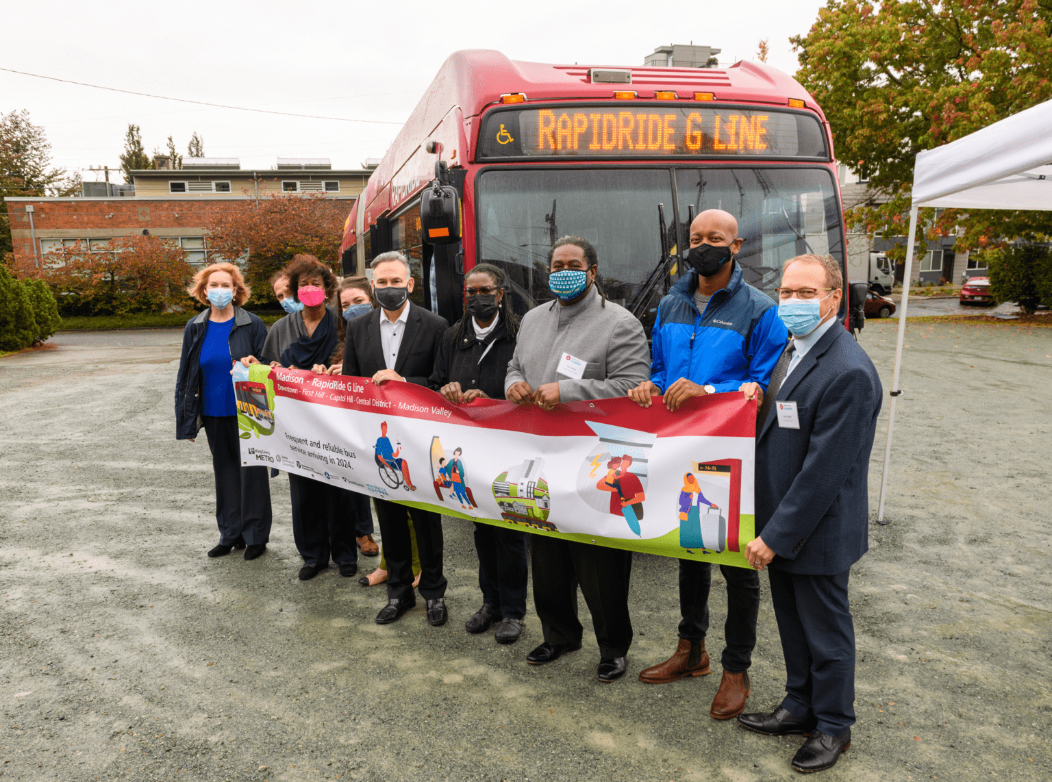 Public transportation leaders and elected officials stand side-by-side with community representatives to celebrate the start of construction on the Madison – RapidRide G Line project at a groundbreaking event in Seattle.