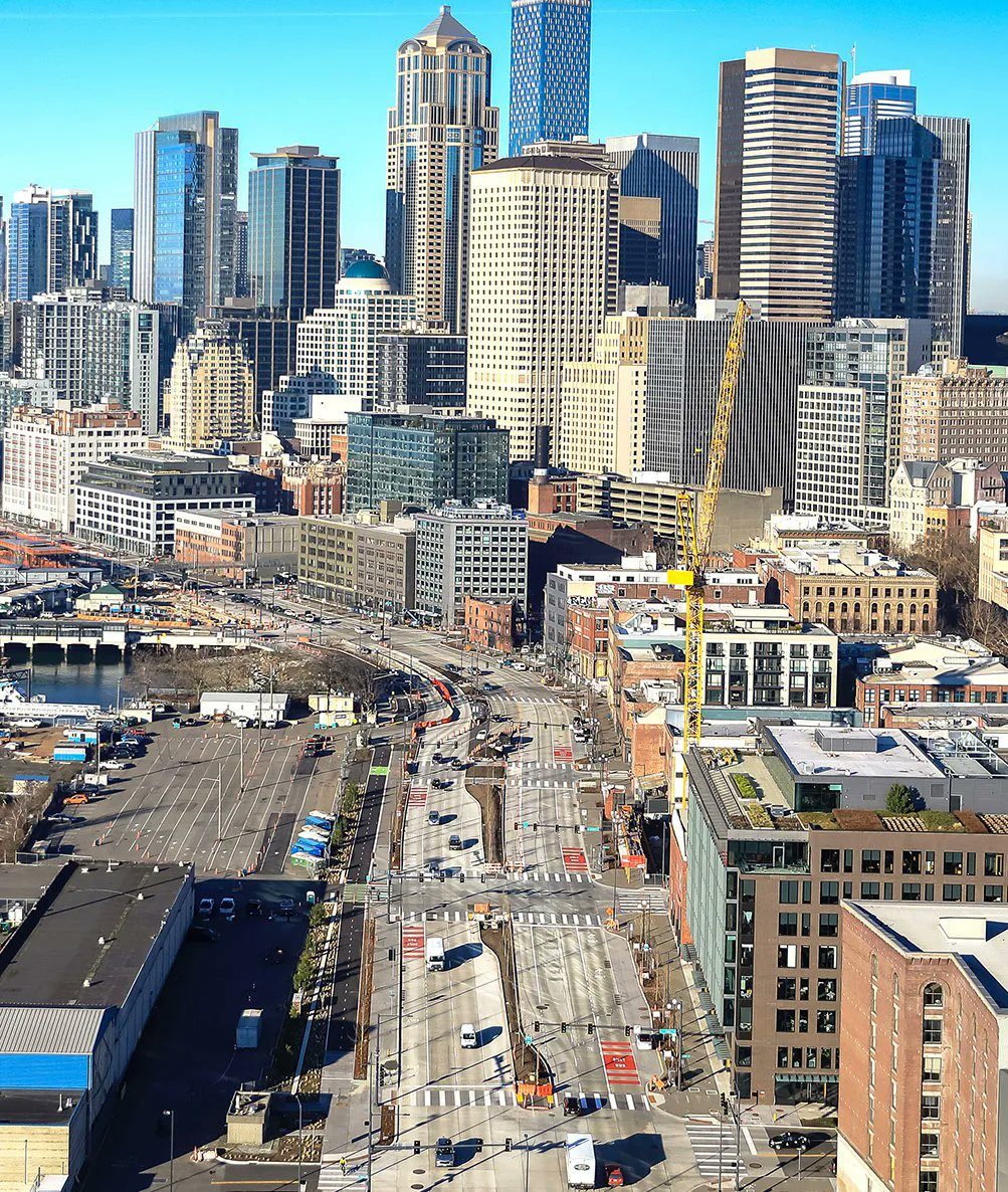 Aerial view of the Seattle waterfront and buildings in downtown Seattle. Two new bus stops recently opened on Alaskan Way S, near S Jackson St.