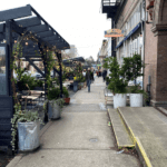 Photo of an outdoor eating area in front of Oddfellows Cafe in Seattle's Capitol Hill neighborhood.
