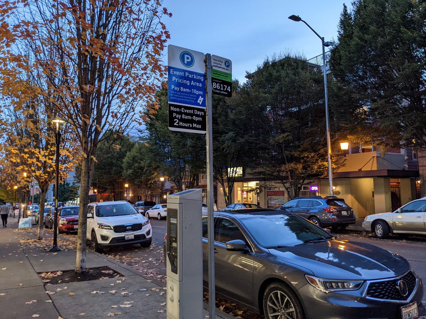 Photo of a sign regarding on-street paid parking in Seattle.