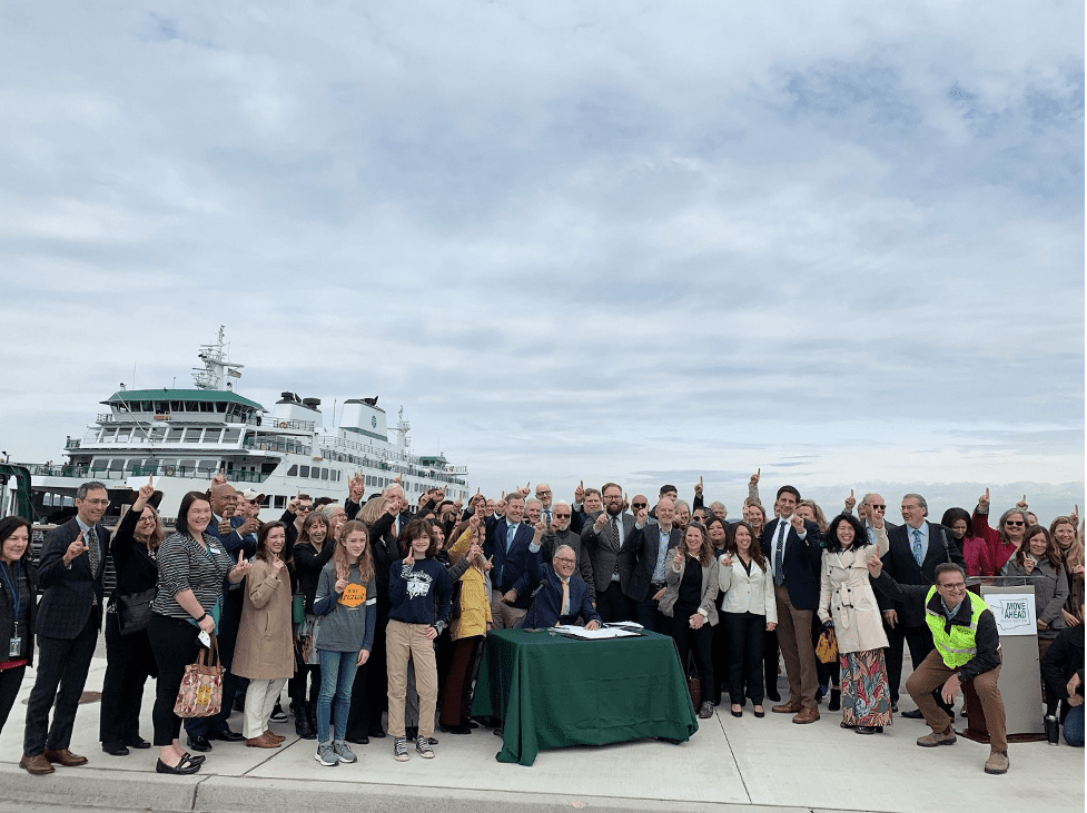 Gov. Jay Inslee joins in celebration with attendees and speakers of the Mukilteo Ferry Terminal bill signing event on March 25, 2022. 