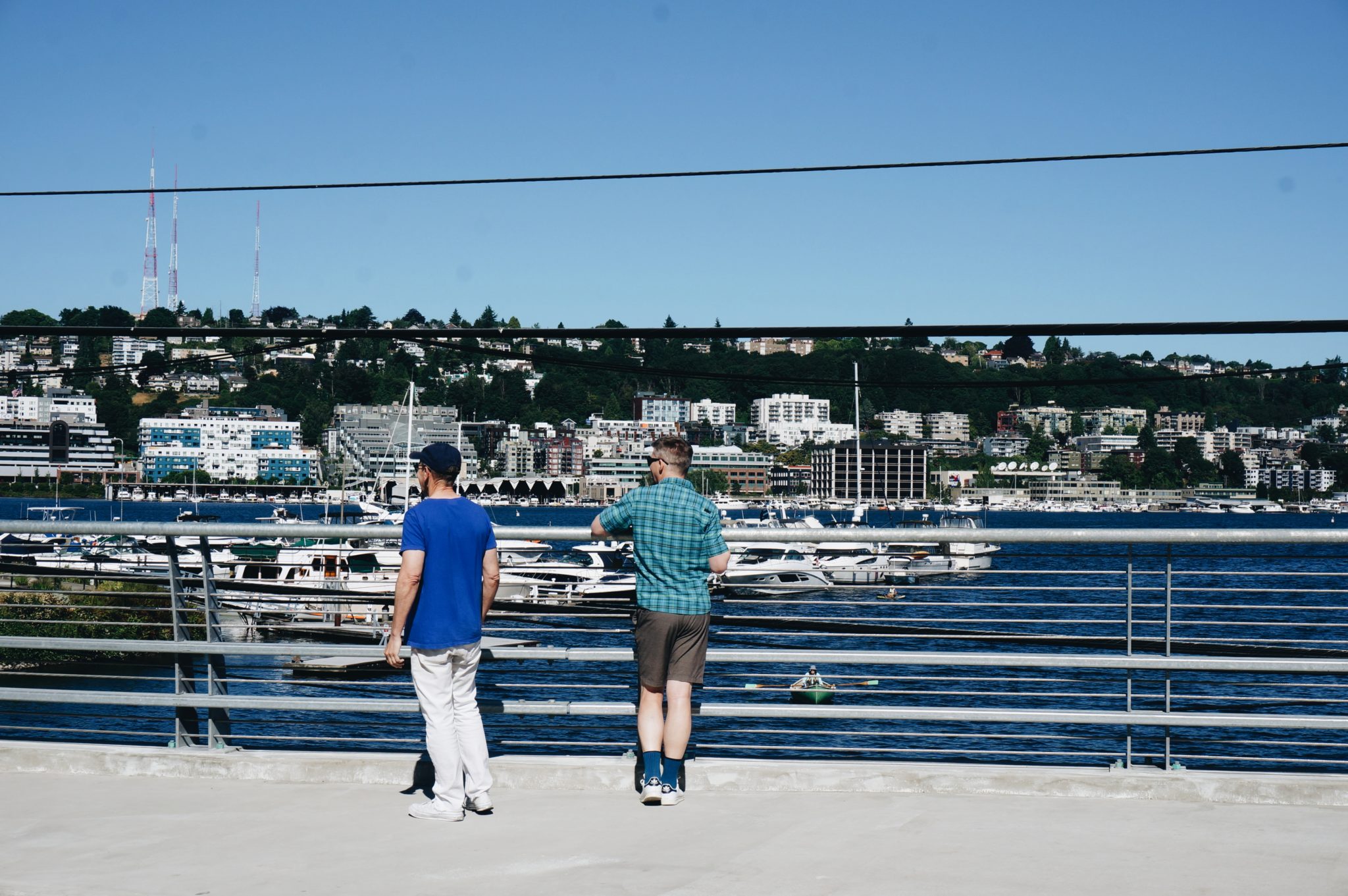 Two people enjoy views of Lake Union from the new Fairview Ave N Bridge.