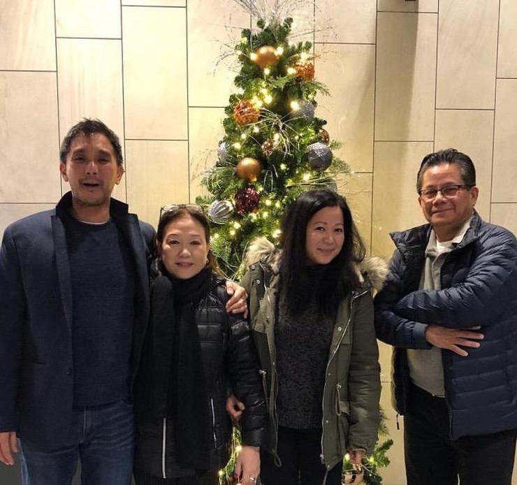 Fred Perez (left) poses for a picture with his family during the holidays in 2021, including his parents and his sister.