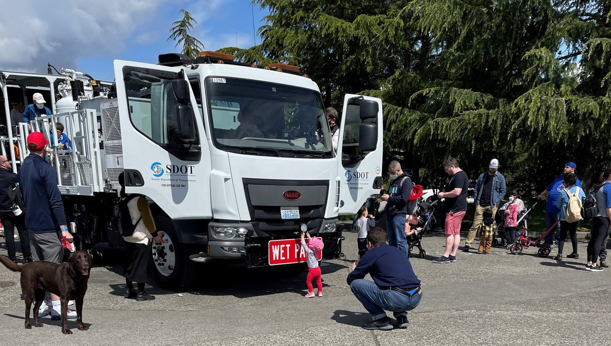 A youngster checks out the front of the SDOT paint truck while other attendees step into the driver’s seat and walk around the back end.