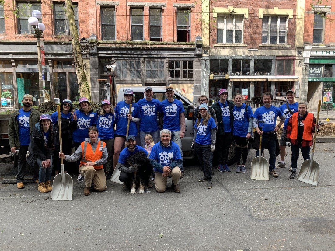 Community volunteers smile for a photo during their work in Pioneer Square as part of the One Seattle Day of Service on Saturday, May 21.