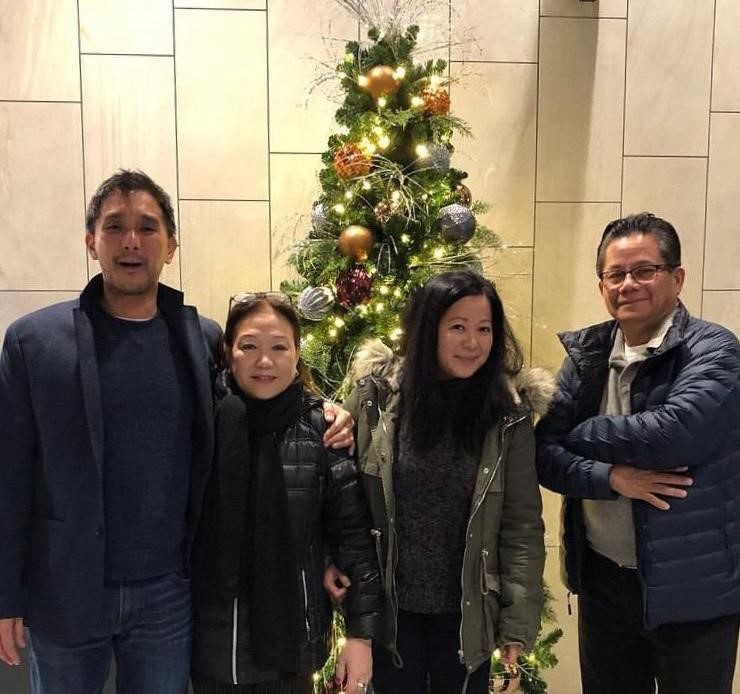 Fred Perez (left) poses for a picture with his family during the holidays in 2021, including his parents and sister.