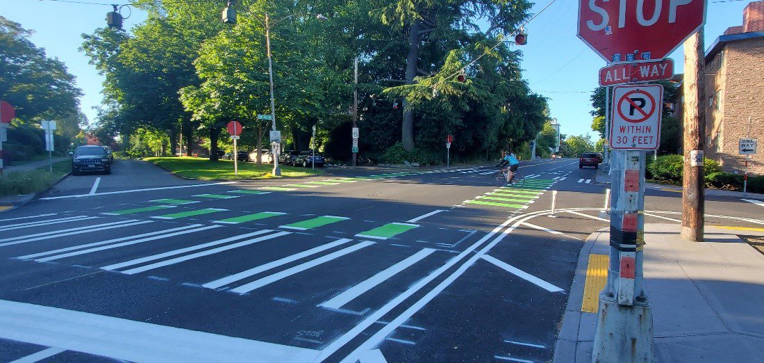 At 15th Ave NE and NE Ravenna Blvd, we added crossbikes (green crossings for bikes) to make people biking more visible, in response to feedback from the community. Photo: SDOT 