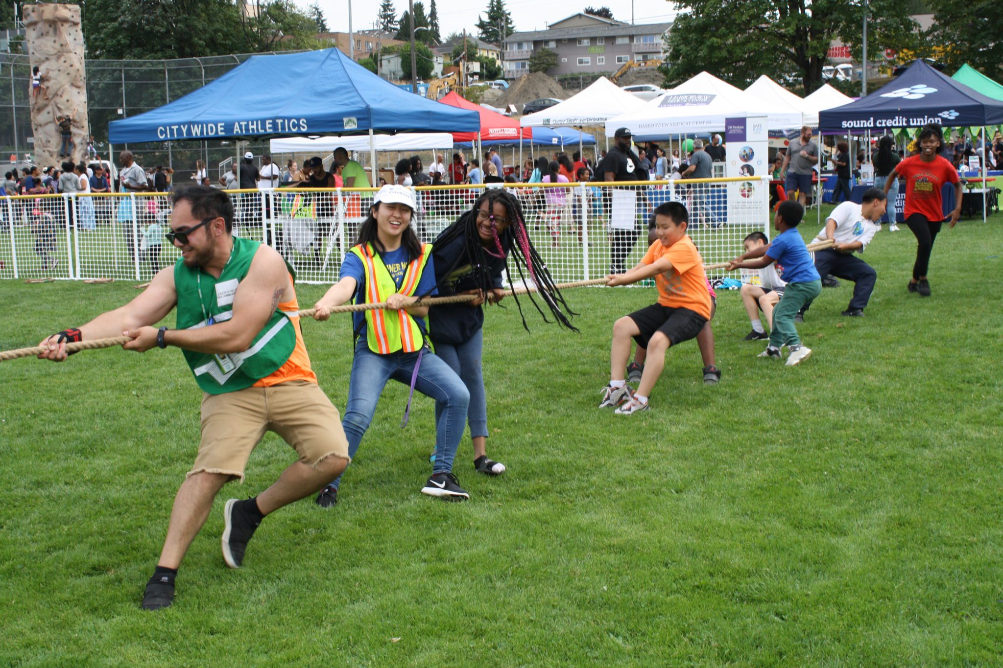 People play tug-of-war at a past Day of Play.