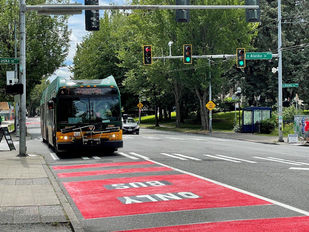 A recently constructed bus-only lane on Rainier Ave S. The bus travels in a lane painted red with the words 