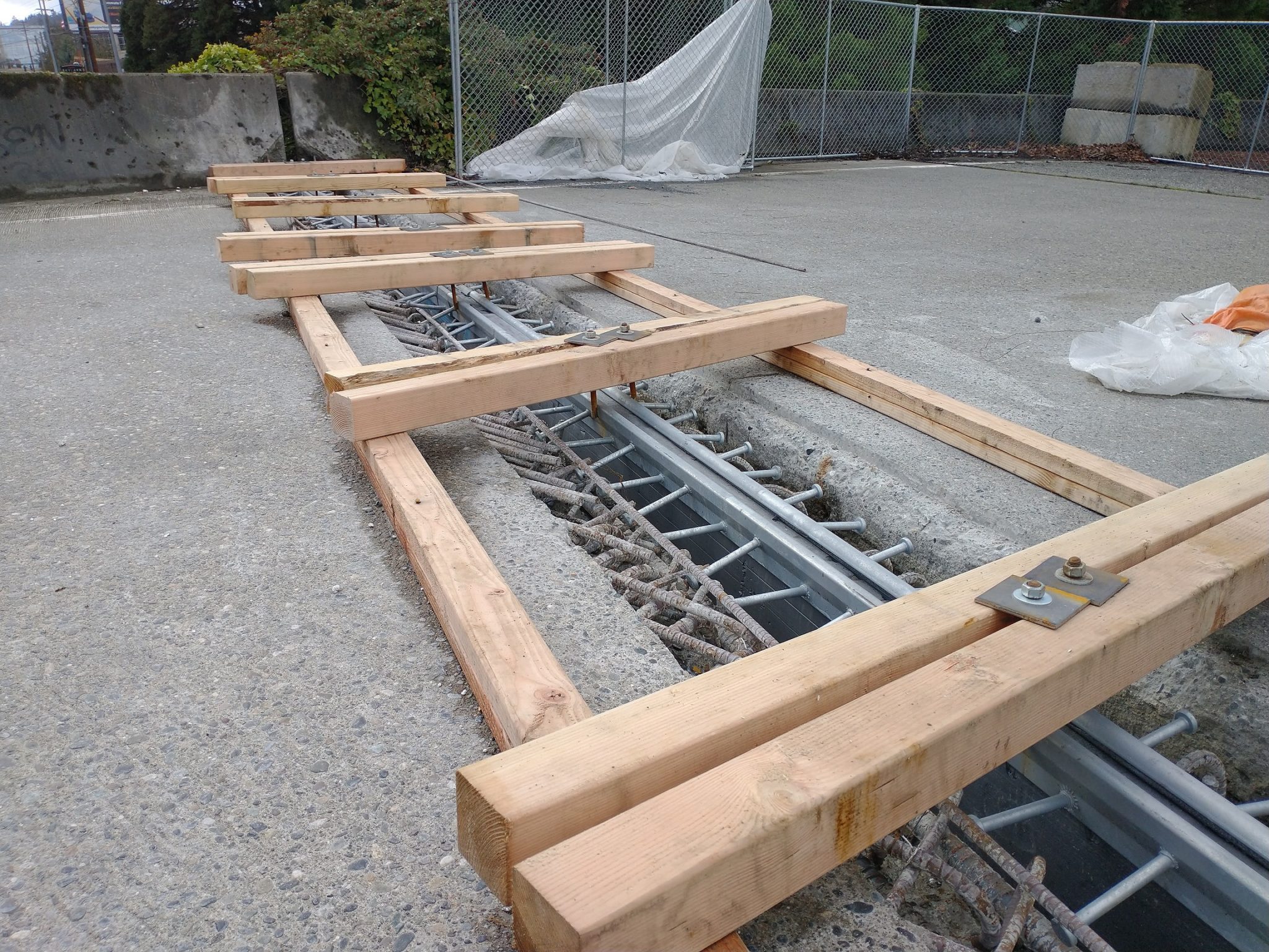 As the seasons change, varying temperatures cause bridges to expand and contract. This photo shows an expansion joint on the bridge, including large pieces of wood on top.