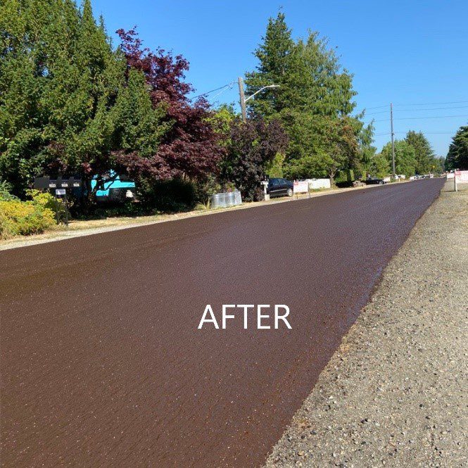 Freshly resurfaced and smooth, dark pavement on a street in Seattle.