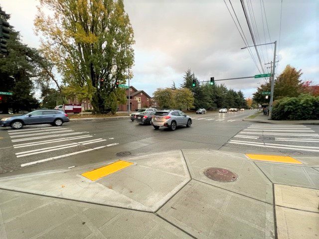 New ADA accessible curb ramps and sidewalk at NE 70th St and on Sand Point Way NE. Photo credit: SDOT.